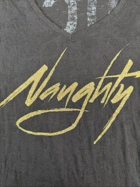 Stranded Black V-Neck Graphic Tee with Gold "Naughty" Script